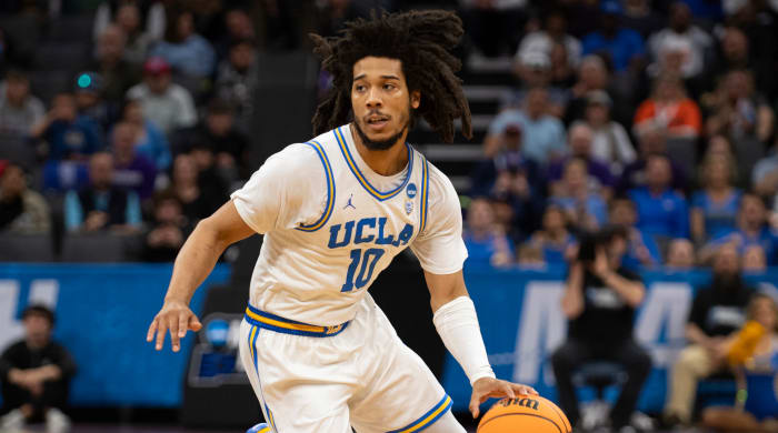 UCLA guard Tyger Campbell dribbles